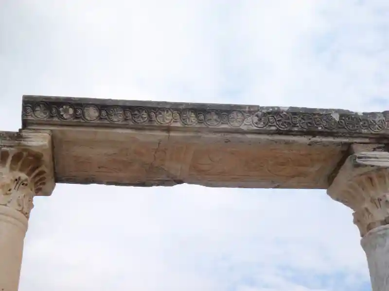 Stone pillar with solar symbols